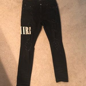 Amiri distresses logo jeans